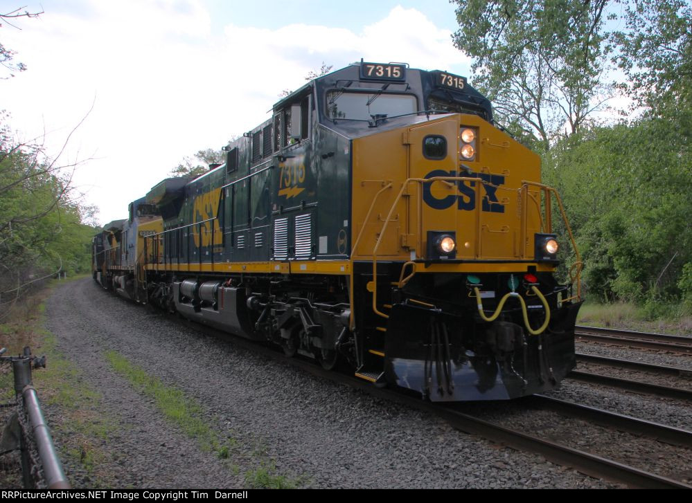 CSX 7315 leads detour train M372 over the NS.